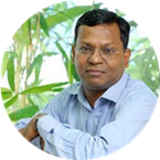 A person with his arms crossed

Description automatically generated
